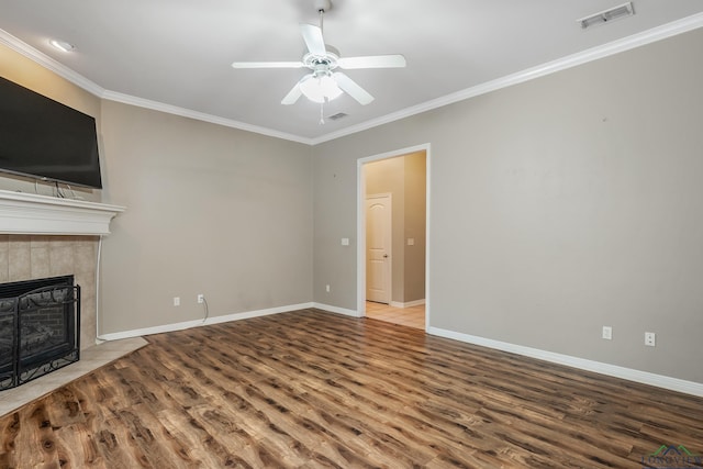 unfurnished living room featuring crown molding, hardwood / wood-style flooring, a fireplace, and ceiling fan