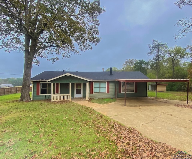 ranch-style house featuring a front yard, a porch, and a carport