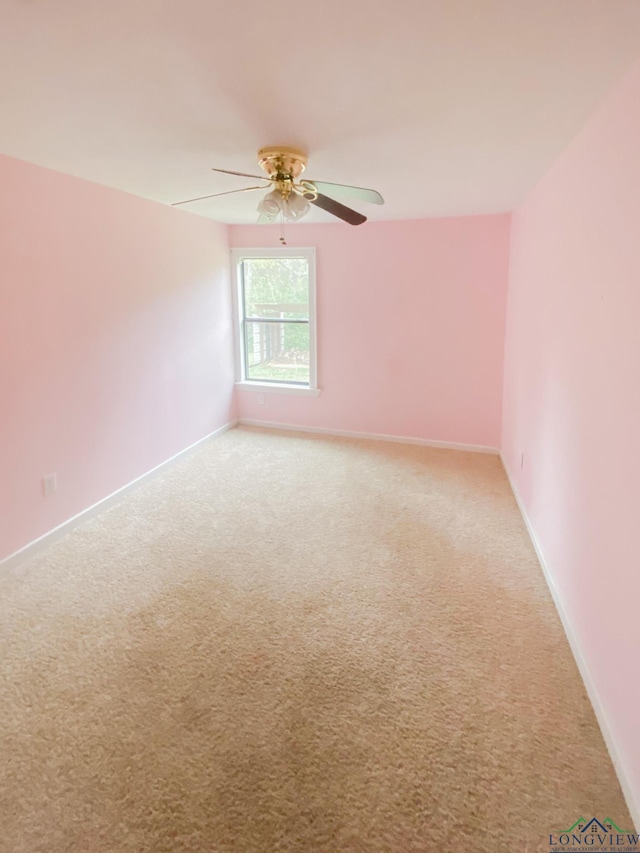 unfurnished room featuring carpet and ceiling fan