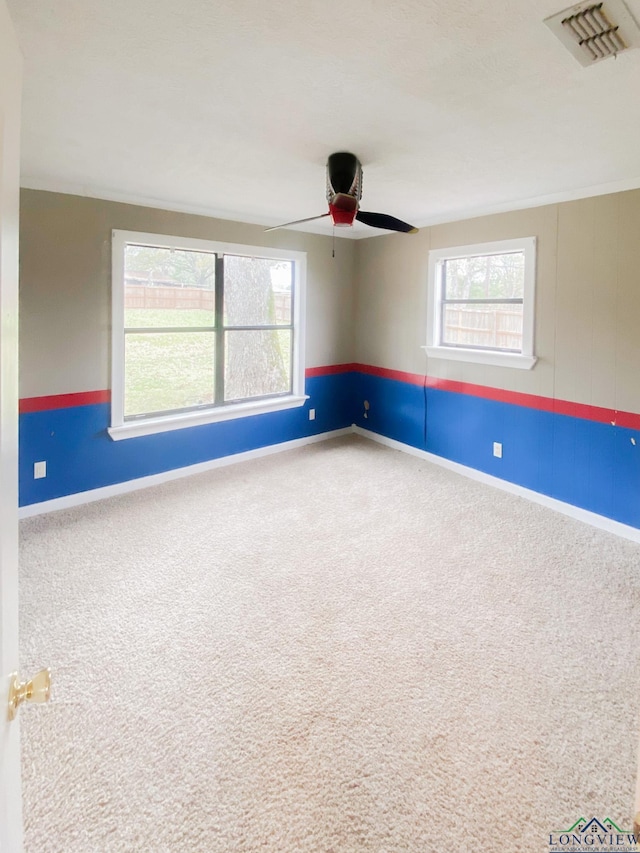 carpeted empty room with ceiling fan