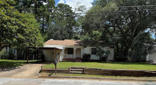 1417 Mahlow Dr, Longview, TX 75601 - view of front of house with driveway, an attached carport, and covered porch