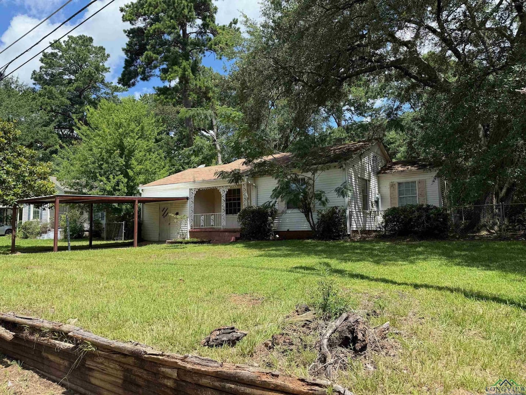 1417 Mahlow Dr, Longview, TX 75601 - view of front facade featuring a front yard and a carport