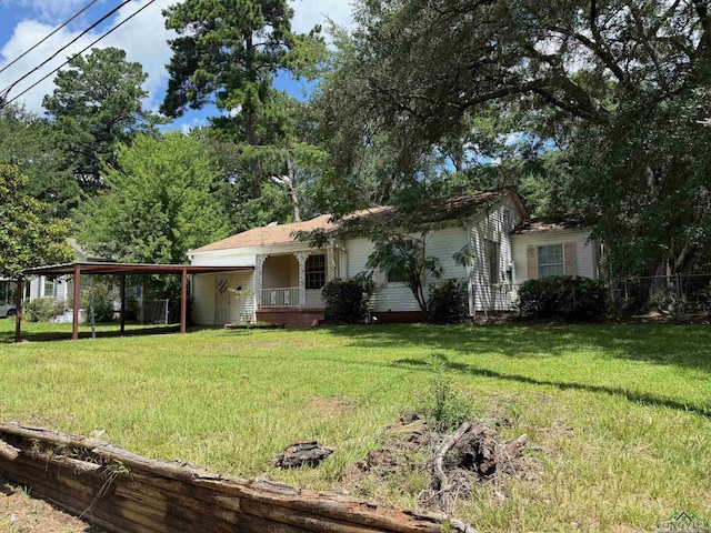 1417 Mahlow Dr, Longview, TX 75601 - view of front facade featuring a front yard and a carport