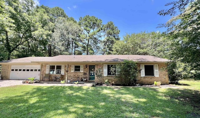 406 Campbell St, Daingerfield, TX 75638 - ranch-style house with brick siding, a garage, a front lawn, and driveway