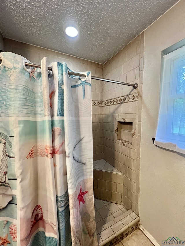 406 Campbell St, Daingerfield, TX 75638 - full bath with a shower stall and a textured ceiling