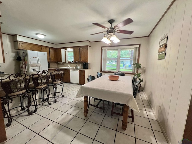 406 Campbell St, Daingerfield, TX 75638 - dining area featuring a ceiling fan, light tile patterned floors, and crown molding