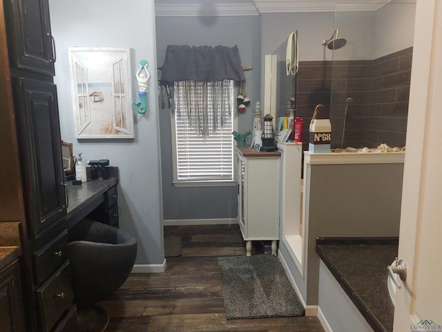 bathroom featuring ornamental molding, baseboards, walk in shower, and wood finished floors