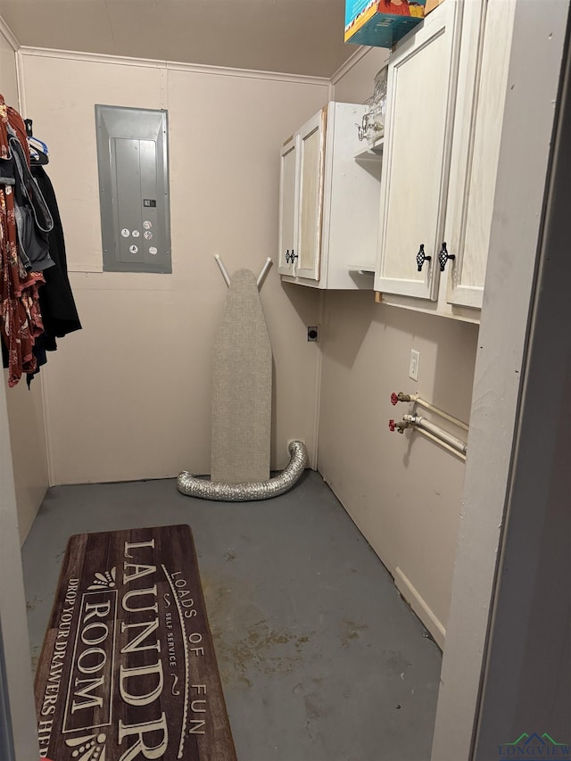 laundry area with electric panel, cabinets, and hookup for an electric dryer