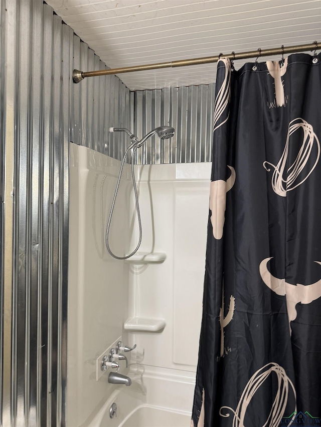 bathroom featuring shower / bath combo with shower curtain