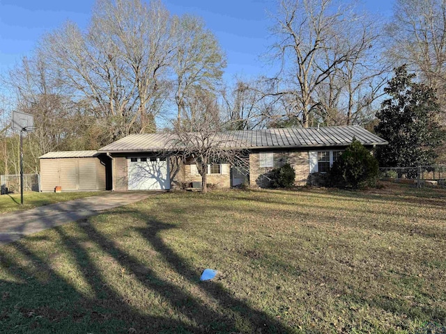 single story home with a front lawn and a garage