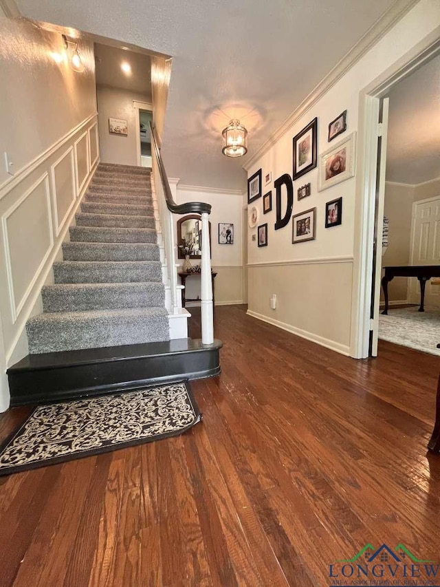 16 Pegues Pl, Longview, TX 75601 - staircase with wood finished floors and ornamental molding