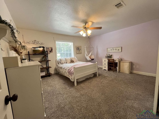 16 Pegues Pl, Longview, TX 75601 - bedroom with a textured ceiling, ceiling fan, and carpet