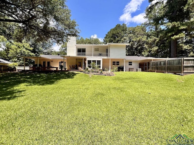 16 Pegues Pl, Longview, TX 75601 - rear view of house with a chimney, a balcony, and a deck