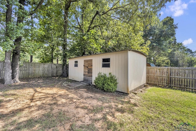 2202 Woodbine Dr, Gladewater, TX 75647 - view of outbuilding with a fenced backyard