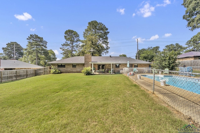 2202 Woodbine Dr, Gladewater, TX 75647 - back of house with a fenced backyard, a patio, a chimney, and brick siding
