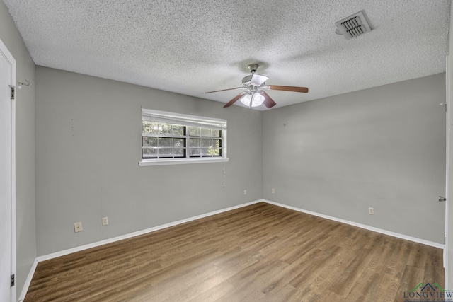 2202 Woodbine Dr, Gladewater, TX 75647 - spare room with ceiling fan, wood finished floors, and a textured ceiling