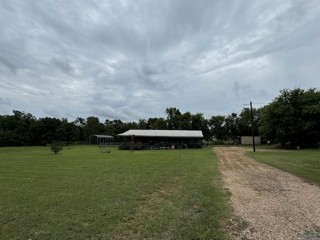 view of property's community with a lawn