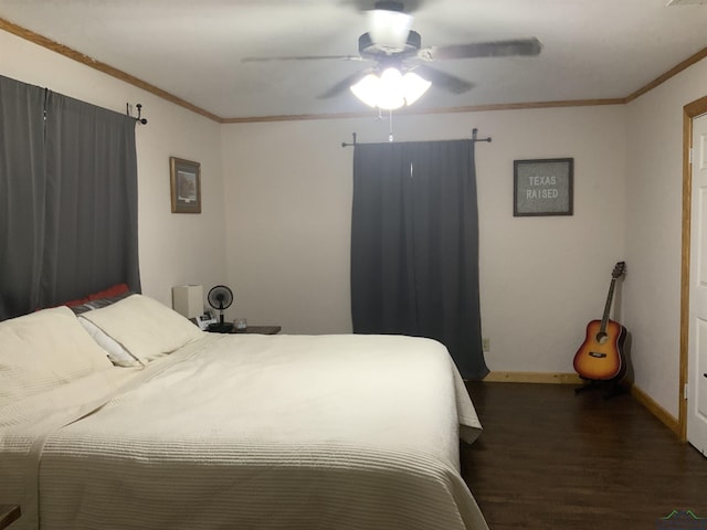 bedroom featuring dark hardwood / wood-style floors, ceiling fan, and ornamental molding