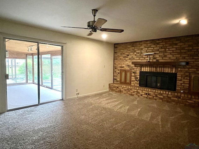 unfurnished living room with a fireplace, carpet flooring, and ceiling fan