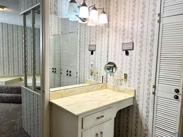 bathroom featuring vanity and a textured ceiling