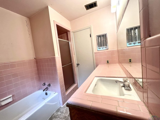 bathroom with vanity and plus walk in shower