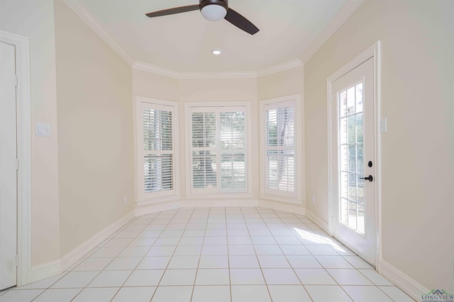 spare room with light tile patterned floors, ceiling fan, ornamental molding, and a healthy amount of sunlight
