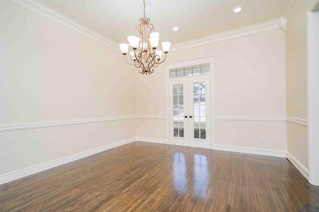 unfurnished dining area featuring crown molding, baseboards, french doors, and a notable chandelier
