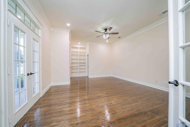 empty room with crown molding, a ceiling fan, french doors, and visible vents