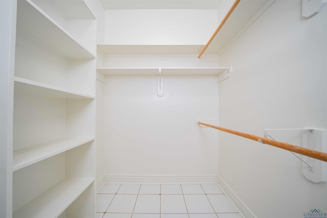walk in closet featuring tile patterned flooring