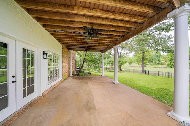 view of patio / terrace featuring french doors and fence
