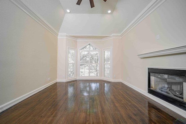 unfurnished living room featuring a glass covered fireplace, baseboards, ceiling fan, and wood finished floors