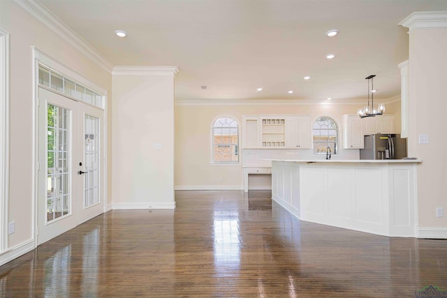 kitchen featuring stainless steel fridge with ice dispenser, plenty of natural light, baseboards, and dark wood-type flooring