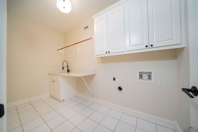 laundry room with washer hookup, hookup for an electric dryer, visible vents, cabinet space, and baseboards