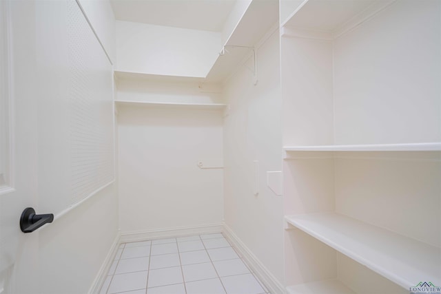 walk in closet featuring tile patterned flooring