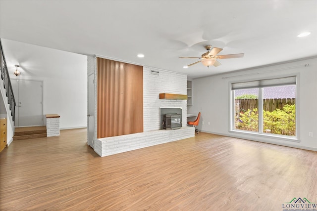1800 Shady Ln, Longview, TX 75604 - unfurnished living room with stairway, a ceiling fan, recessed lighting, wood finished floors, and a fireplace