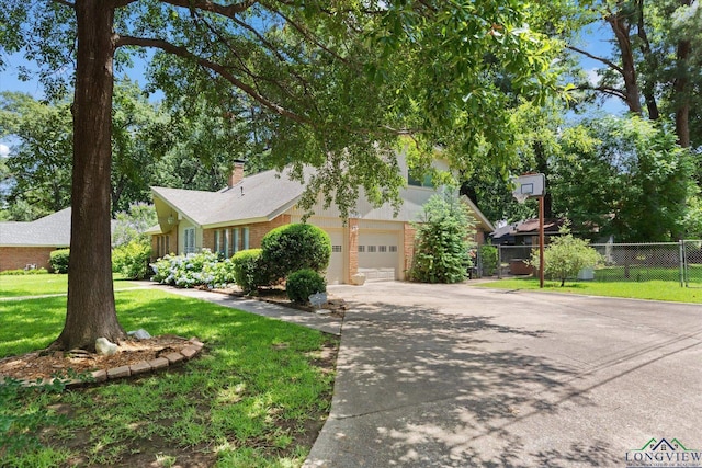 1800 Shady Ln, Longview, TX 75604 - view of property hidden behind natural elements with driveway, a garage, and brick siding