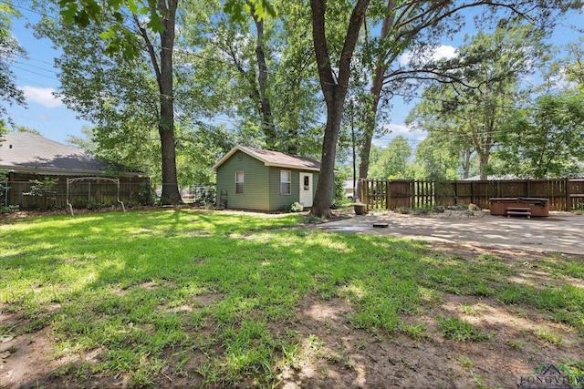 1800 Shady Ln, Longview, TX 75604 - view of yard with a hot tub, an outbuilding, and a patio area