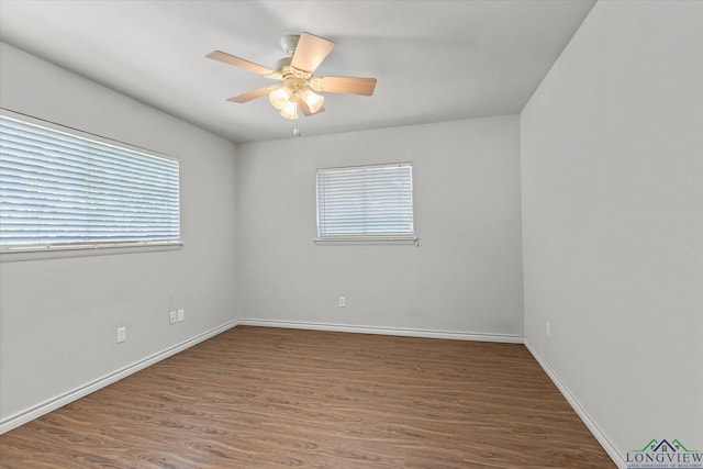 1800 Shady Ln, Longview, TX 75604 - empty room featuring wood finished floors, ceiling fan, and baseboards
