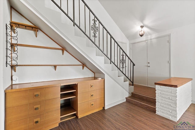 1800 Shady Ln, Longview, TX 75604 - staircase featuring wood finished floors and vaulted ceiling