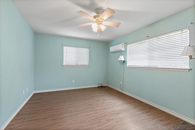 1800 Shady Ln, Longview, TX 75604 - spare room featuring wood finished floors, plenty of natural light, and a ceiling fan