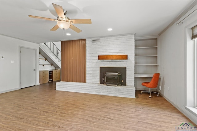 1800 Shady Ln, Longview, TX 75604 - unfurnished living room featuring wood finished floors, stairs, ceiling fan, built in features, and recessed lighting