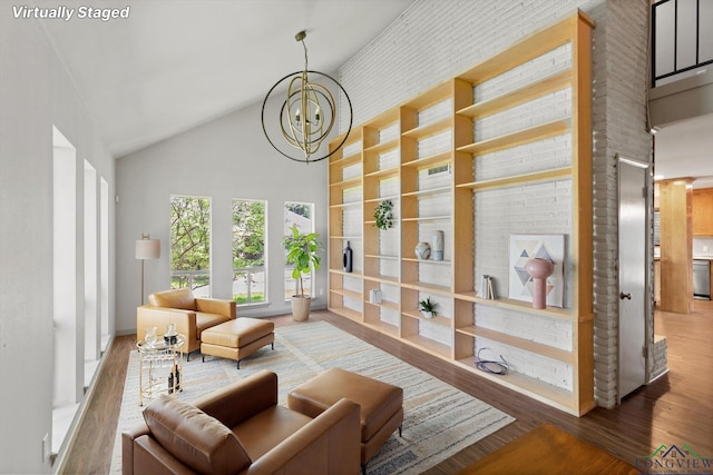 1800 Shady Ln, Longview, TX 75604 - living room with a chandelier, wood finished floors, and lofted ceiling