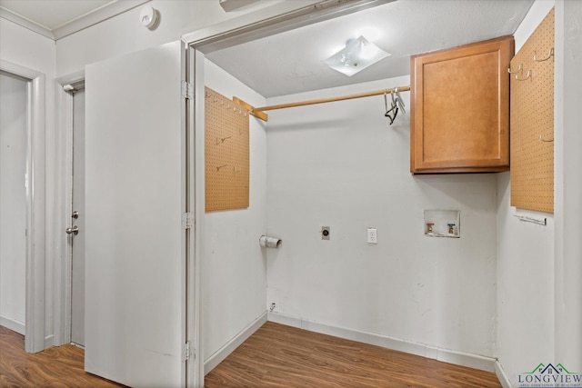 1800 Shady Ln, Longview, TX 75604 - washroom featuring electric dryer hookup, washer hookup, wood finished floors, cabinet space, and baseboards