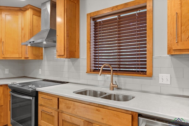 1800 Shady Ln, Longview, TX 75604 - kitchen with stainless steel appliances, wall chimney range hood, a sink, and light countertops