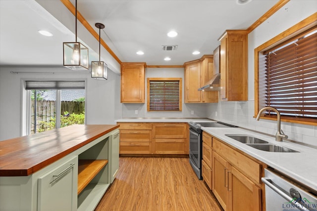 1800 Shady Ln, Longview, TX 75604 - kitchen with butcher block countertops, appliances with stainless steel finishes, a sink, light wood-style flooring, and tasteful backsplash