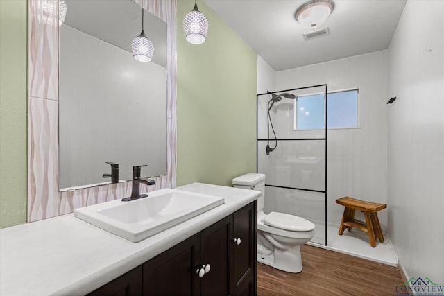1800 Shady Ln, Longview, TX 75604 - full bathroom with toilet, a shower with curtain, vanity, and wood finished floors