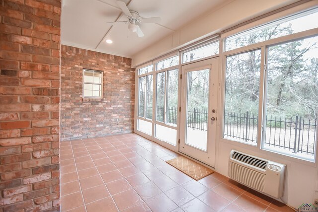 5816 Hollybrook Dr, Tyler, TX 75703 - unfurnished sunroom featuring brick wall, tile patterned floors, a wall mounted air conditioner, and french doors