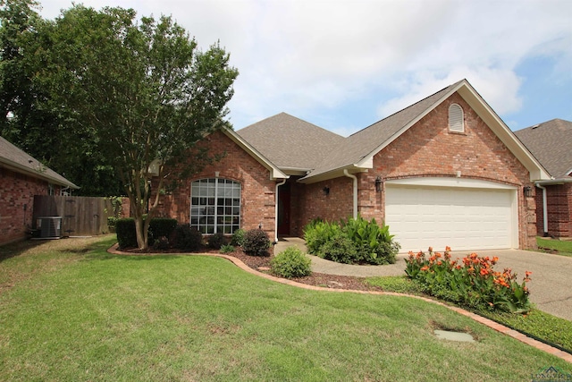 5816 Hollybrook Dr, Tyler, TX 75703 - view of front of house featuring brick siding, an attached garage, central AC unit, and driveway