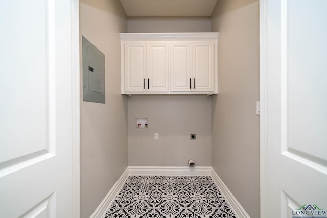 washroom featuring hookup for an electric dryer, tile patterned flooring, hookup for a washing machine, cabinets, and electric panel