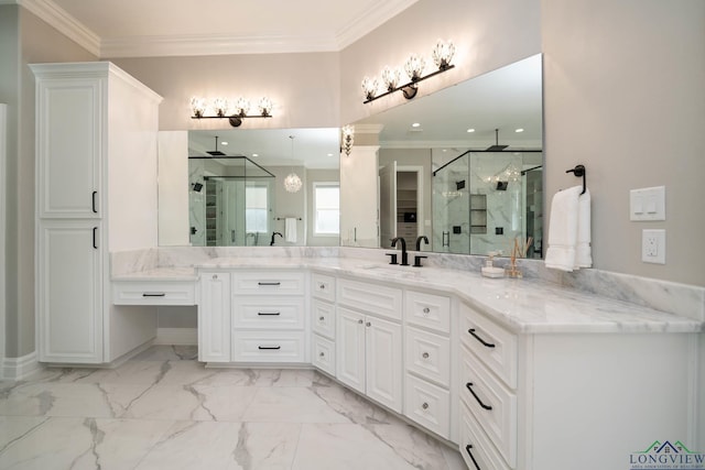 bathroom featuring a shower with shower door, vanity, and ornamental molding